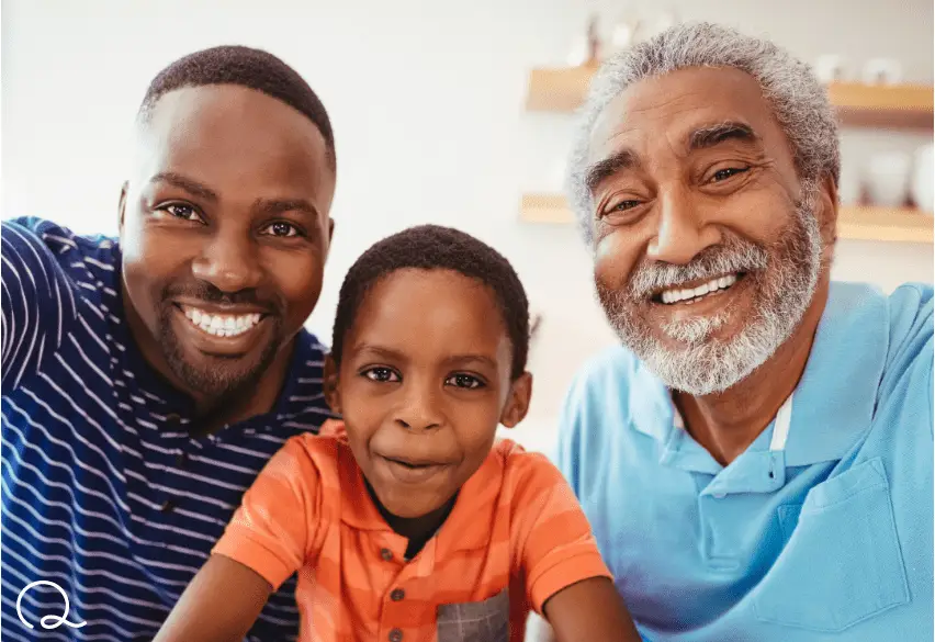 father, son and grandfather smiling at camera