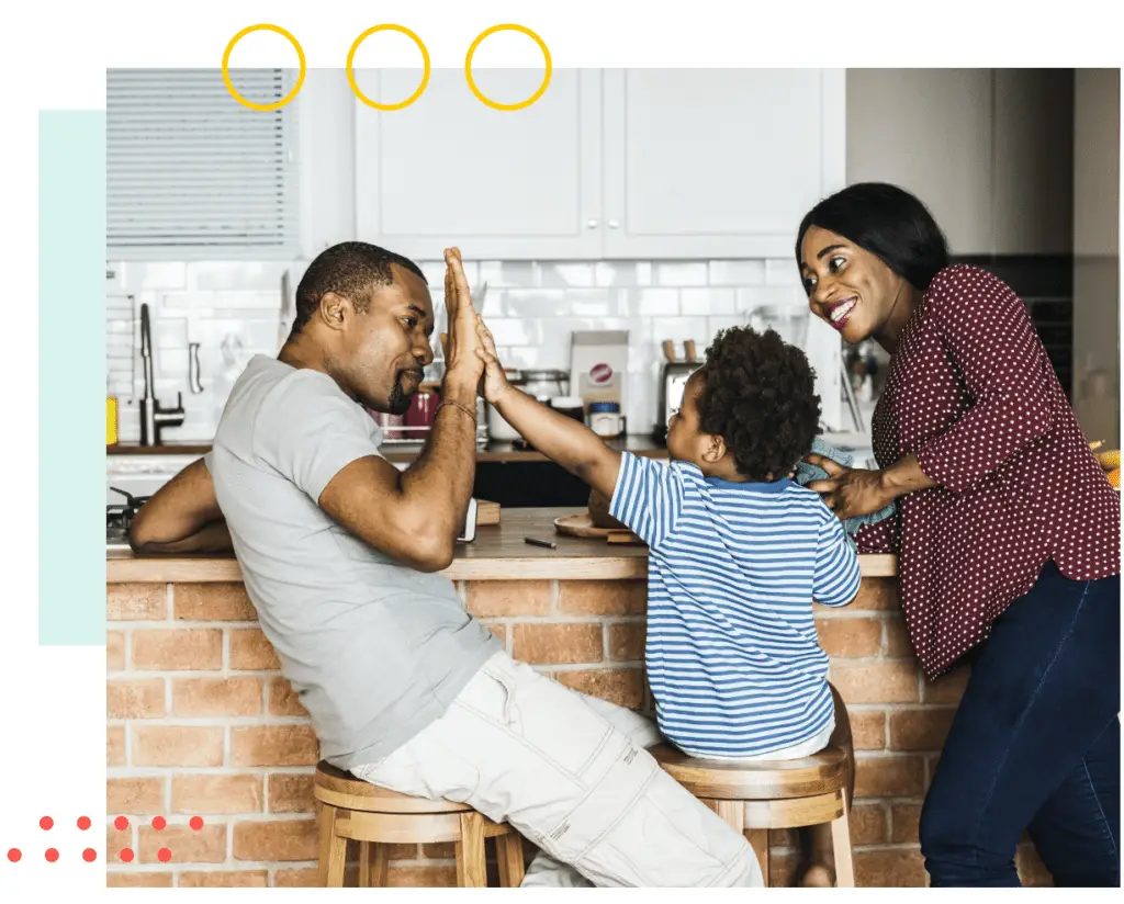 Father, mother and son standing in kitchen, just applied online for mortgage protection insurance with Quility